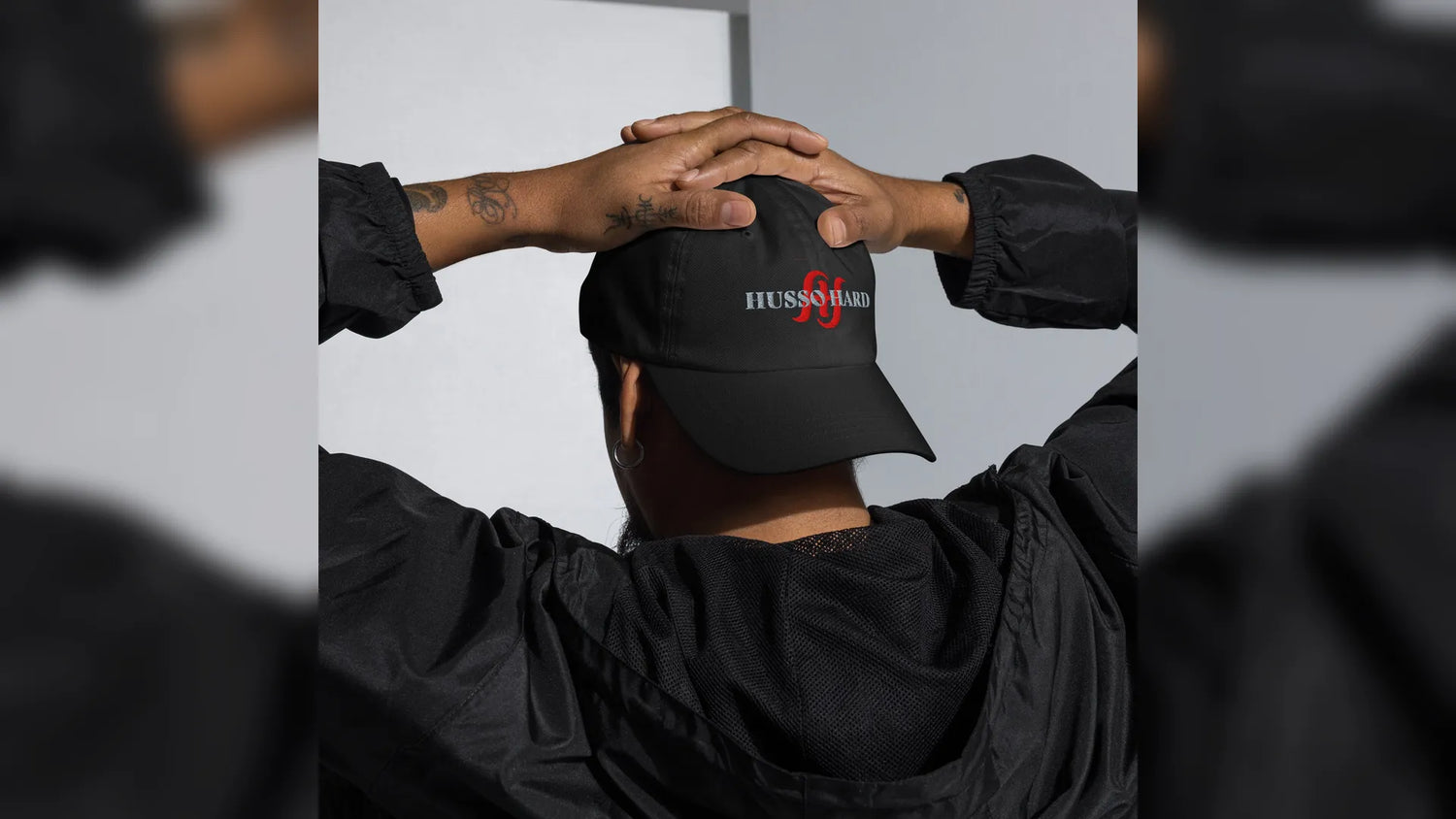 Back View of person wearing black Husso Hard logo hat for hats collection