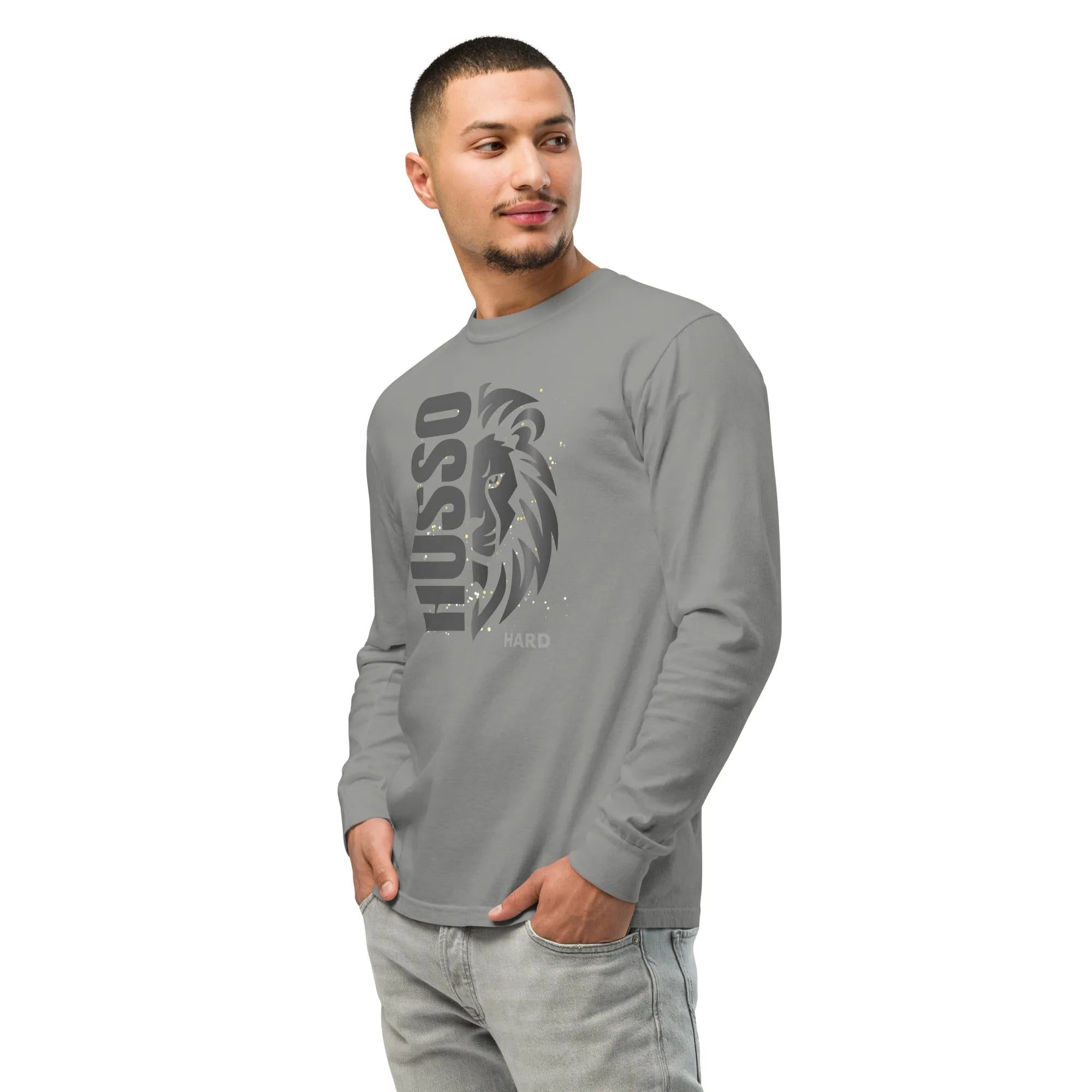 Man wearing grey Husso Hard long sleeve shirt with lion graphic and light wash jeans