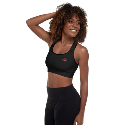 Woman wearing black Husso Hard minimal logo padded sports bra, left angle