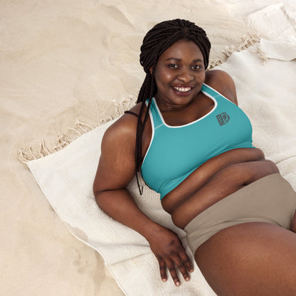 Woman wearing blue Husso Hard padded sports bra with lion logo