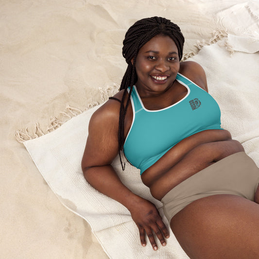 Woman wearing blue Husso Hard padded sports bra with lion logo